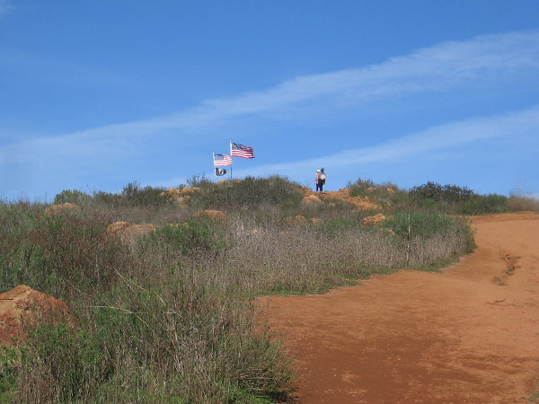 Flags show we've almost reached the Rock House atop Mother Miguel Mountain.