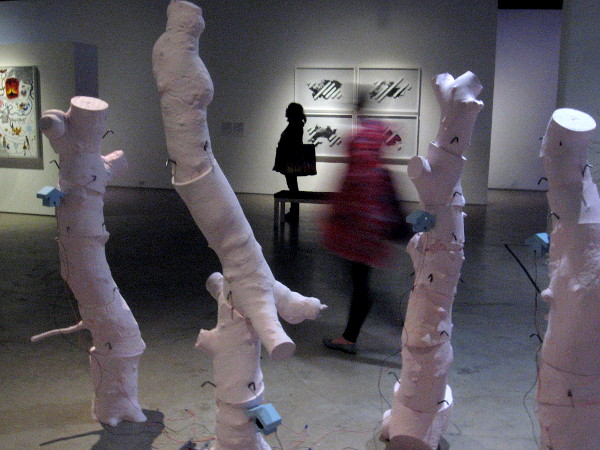 Moving through a gallery full of strangeness. Complex mysteries and unseen realities surround and penetrate each of us.