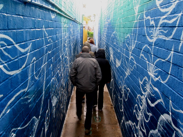 Our group heads through the beautifully painted walkway of Randall's Sandals, where the long mural opens up for all to see.