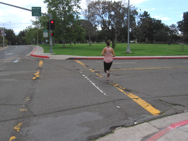 A lone jogger heads south down quiet Park Boulevard.