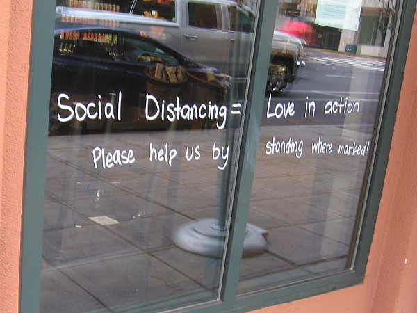 In one window: Social distancing equals love in action.