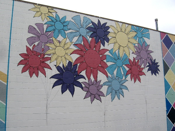 These colorful flowers are at the center of the mural.