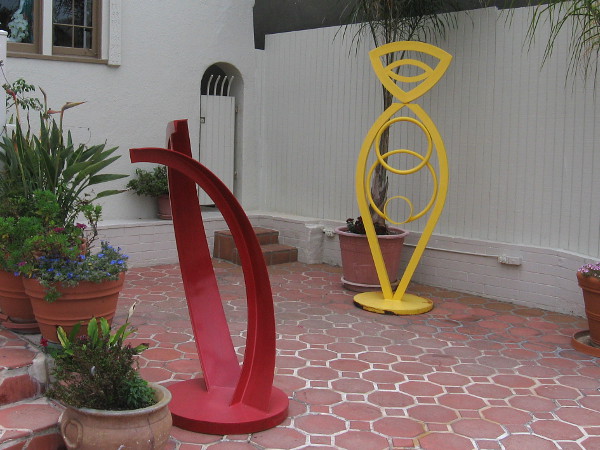 Two of five colorful sculptures, on a patio in front of 1261 Prospect Street.