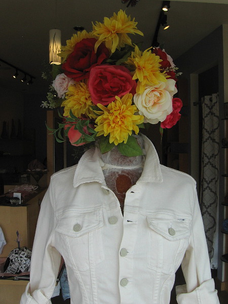 A flowery head in the window at Robina Apparel and Accessories.