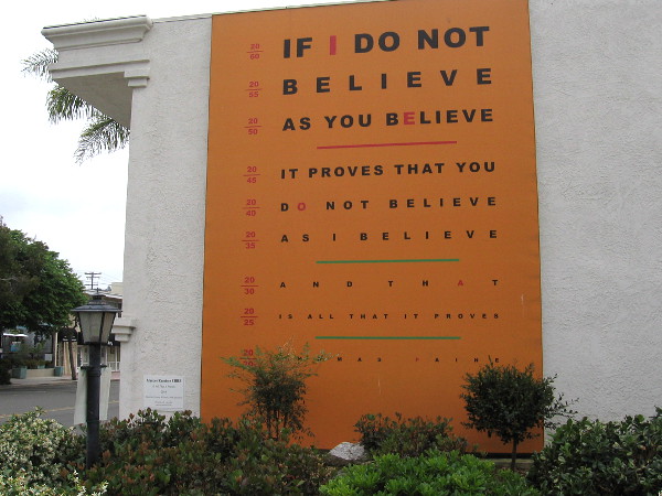 Is All That it Proves, 2015, by artist Marcos Ramirez ERRE. Thomas Paine's famous quote as an eye exam chart, asserting opinion is simply opinion.