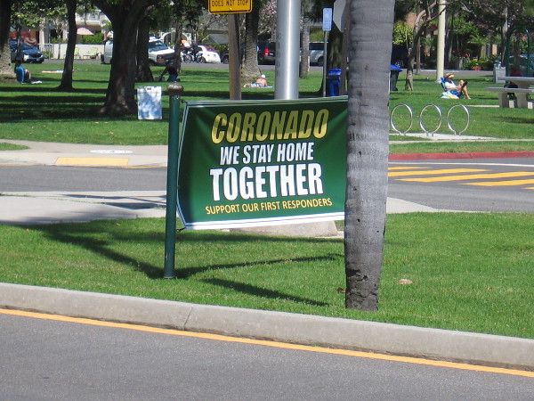 One banner on the Orange Avenue median near Spreckels Park says Coronado We Stay Home Together. Support Our First Responders.