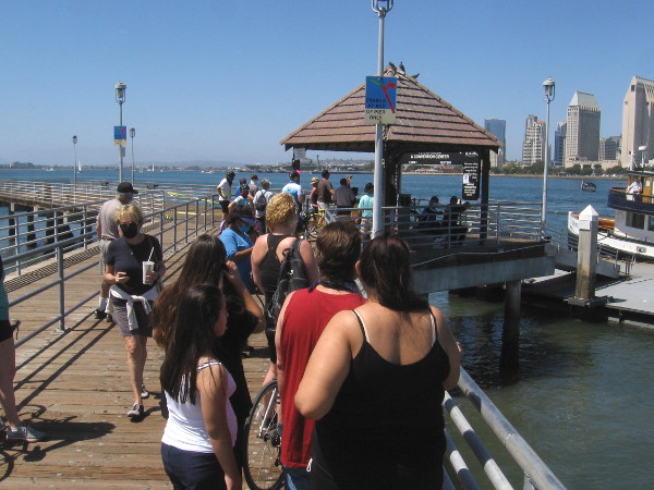 The Coronado ferry will depart for downtown San Diego shortly. I stayed at a distance from the group ahead of me. They were told to don masks before boarding the ferry.