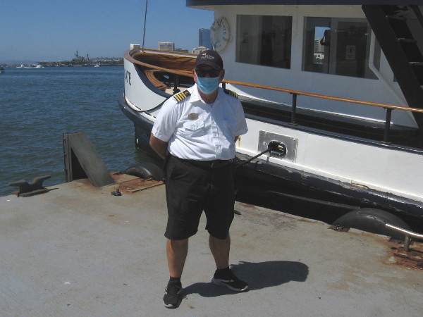 The captain of the Silvergate poses for a photograph wearing his face mask. Thank you for taking us under the horns of the USS Midway and past a sea lion on a buoy!
