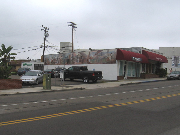 I spotted a long mural along the roof of the building at 2168 Chatsworth Boulevard.