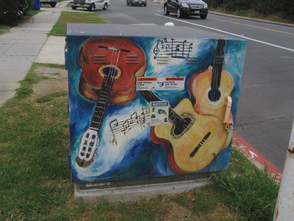 An electrical box up the street was painted with all sort of guitars.