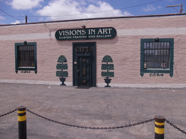 Trees painted on either side of the door to Visions In Art.