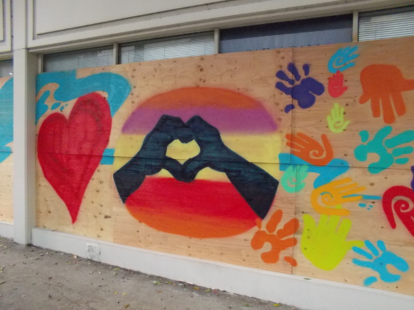 A heart is possible with hands of all colors.