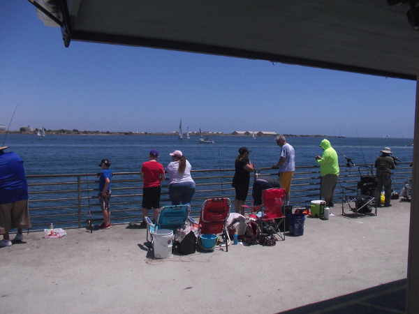 A perfect sunny day on the Shelter Island Pier. Across the bay you can see North Island Naval Air Station.