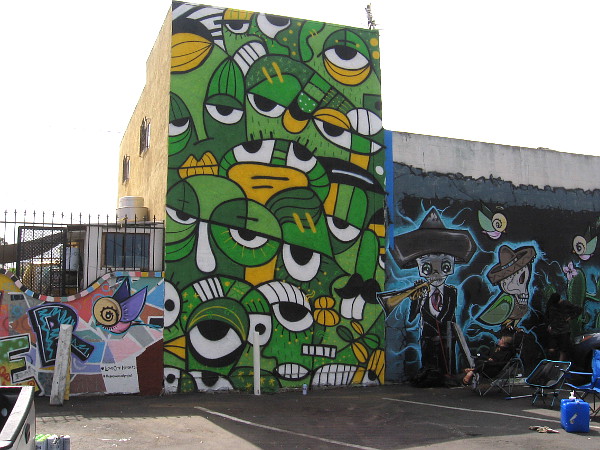 The new mural appears between two others that were previously painted on the east side of Super Cocina.