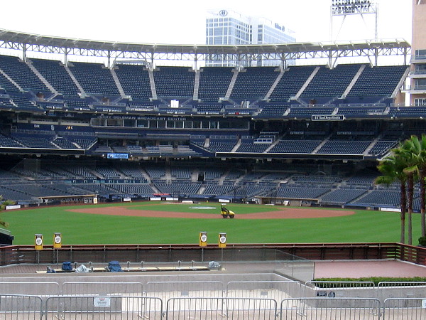 Petco Park is newly painted and empty as the grounds crew prepares the field for Padres baseball. No fans will be in attendance this shortened season.