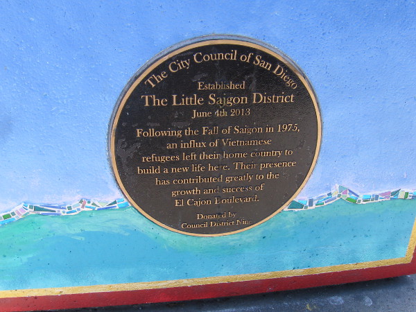 Plaque on side of the planter indicates The Little Saigon District was established on June 4th, 2013. Vietnamese refugees have built a new life here.