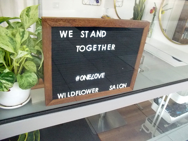 We Stand Together in the Wildflower Salon window.