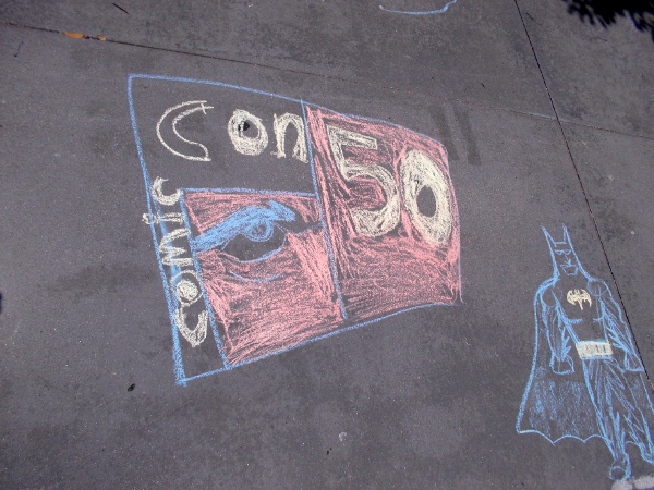 Chalk art reminds passersby in Gaslamp Square that 2020 is the 50th anniversary of San Diego Comic-Con. This year, due to the coronavirus pandemic, the event is being held entirely online.