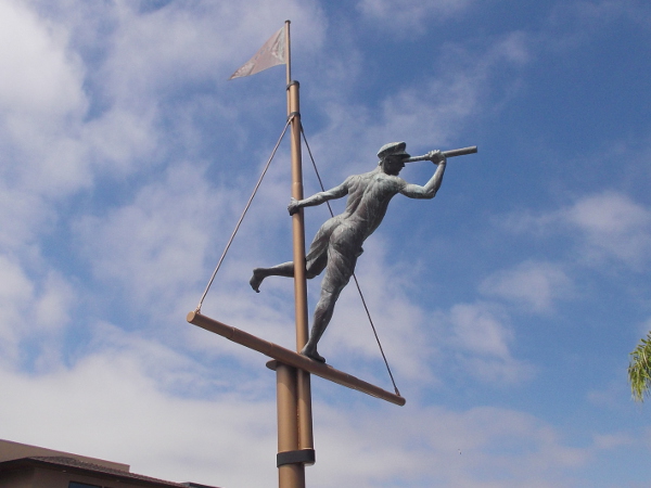 Sculpture of sailor on mast with spyglass, by artists T.J. Dixon and James Nelson, at San Diego's Silver Gate Yacht Club on Shelter Island.
