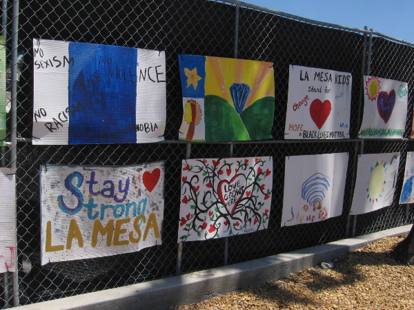 Positive messages of love and equality on a fence in La Mesa.