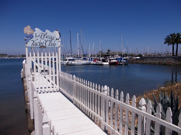 The short pier of the modest La Playa Yacht Club. Beyond lie boats of the much larger Southwestern Yacht Club.