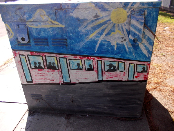 Trolley windows full of passengers.