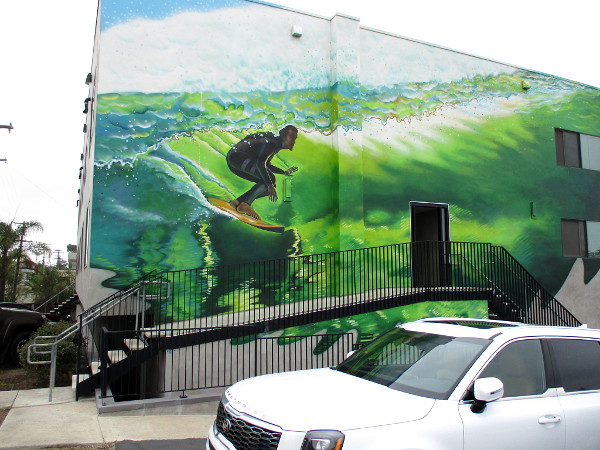The mural was painted from a photo taken by surf photographer Todd Glaser of pro-surfer Rob Machado, both Cardiff residents.