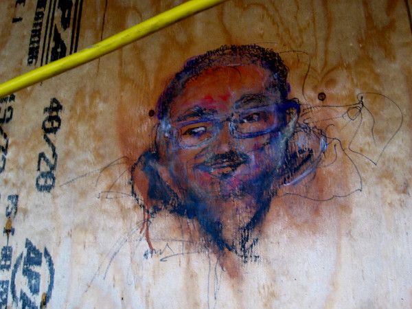 I'm greeted by this face on the construction site fence!