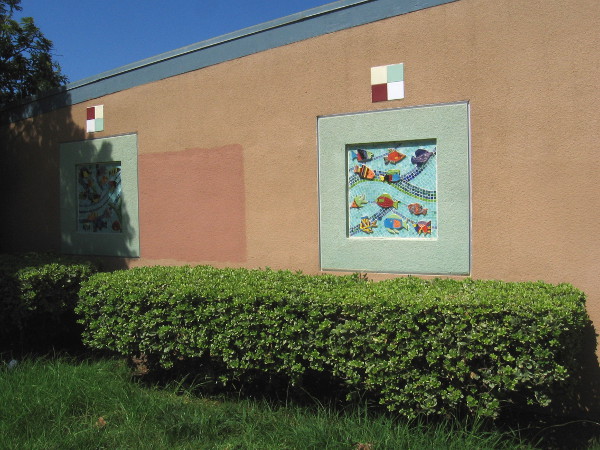 Two mosaics depicting colorful fish outside Perkins Elementary School at Newton Avenue and Beardsley Street in Barrio Logan.