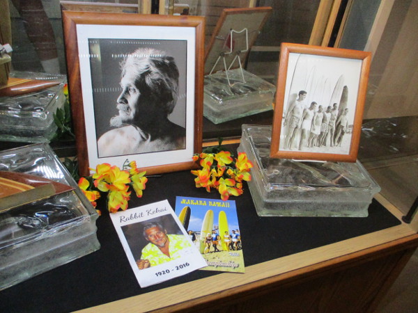 A museum display memorializes local surfers who've passed on.