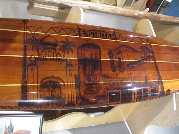 A redwood surfboard by Francis Todd II and Mary Krahn pays tribute to popular Southern California surfing destination Encinitas.