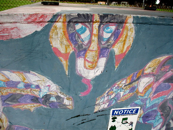 Three colorful reptilian creatures.