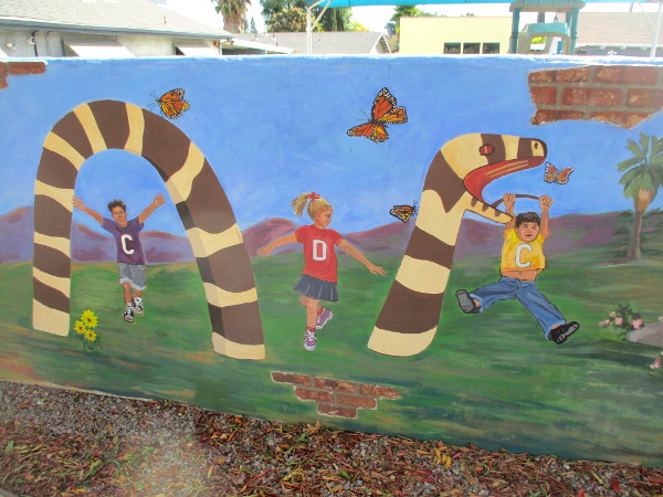 Kids of Escondido Community Child Development Center play on big Snake Slide inspired by Queen Califia's Magical Circle.